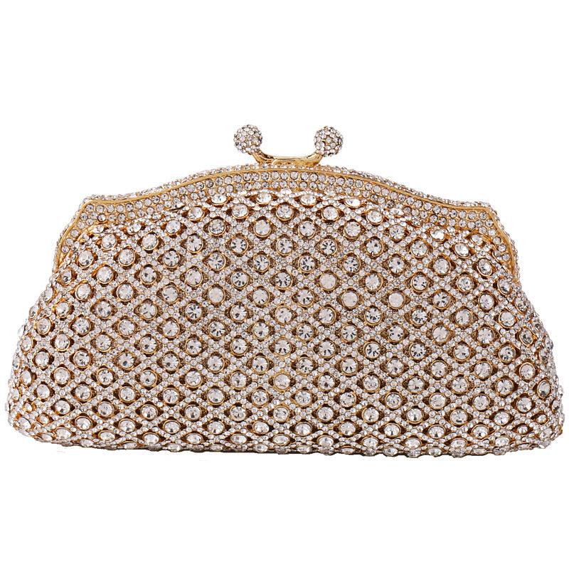 Elegant gold clutch with structured design and clasp top on white background