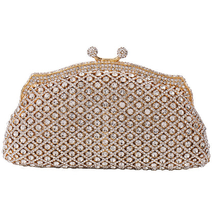 Elegant gold clutch with structured design and clasp top on white background