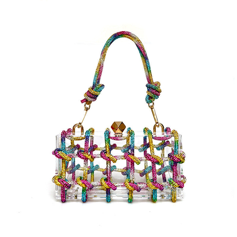 A shiny rainbow multicolor rhinestone-encrusted acrylic clear handbag in a square shape with a single shoulder strap and gold-colored hardware.