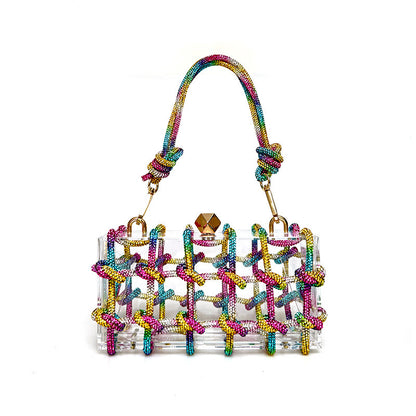 A shiny rainbow multicolor rhinestone-encrusted acrylic clear handbag in a square shape with a single shoulder strap and gold-colored hardware.