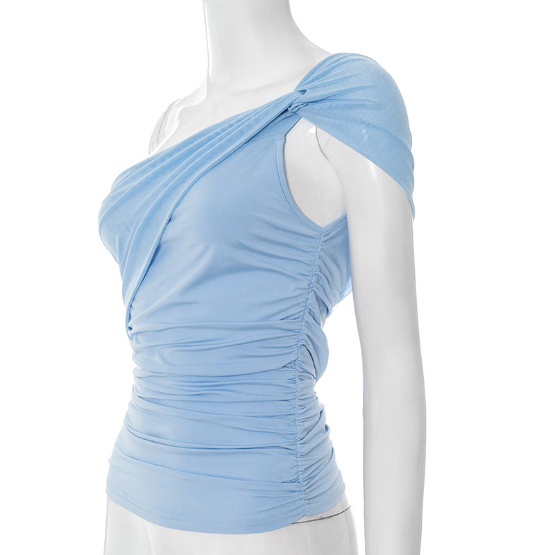 Side view of light blue one-shoulder mesh top on a mannequin against a white background