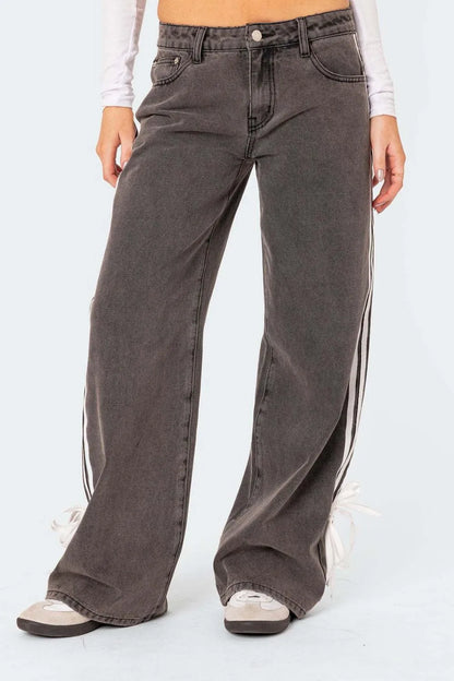 Model wearing dark wash side Striped Loose Fit Jeans front view