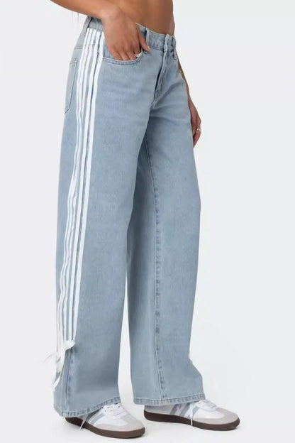 Model wearing light wash side Striped Loose Fit Jeans side view