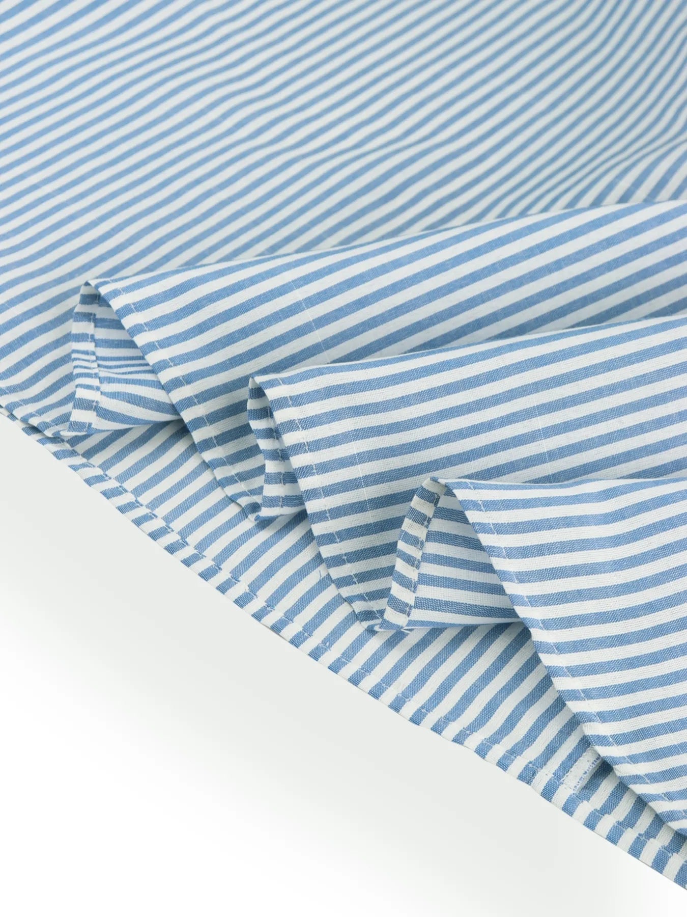 close up view of hem of blue casual striped midi summer dress