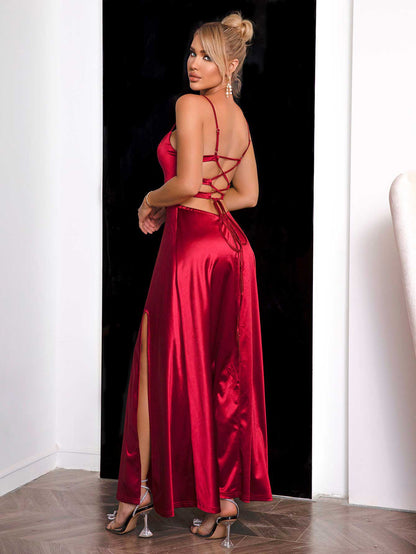 Open lace-up back detail of sultry red maxi dress on a model 