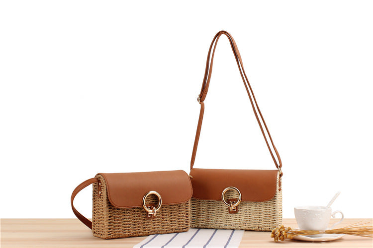two brown woven straw handbags with woven design on a wooden surface
