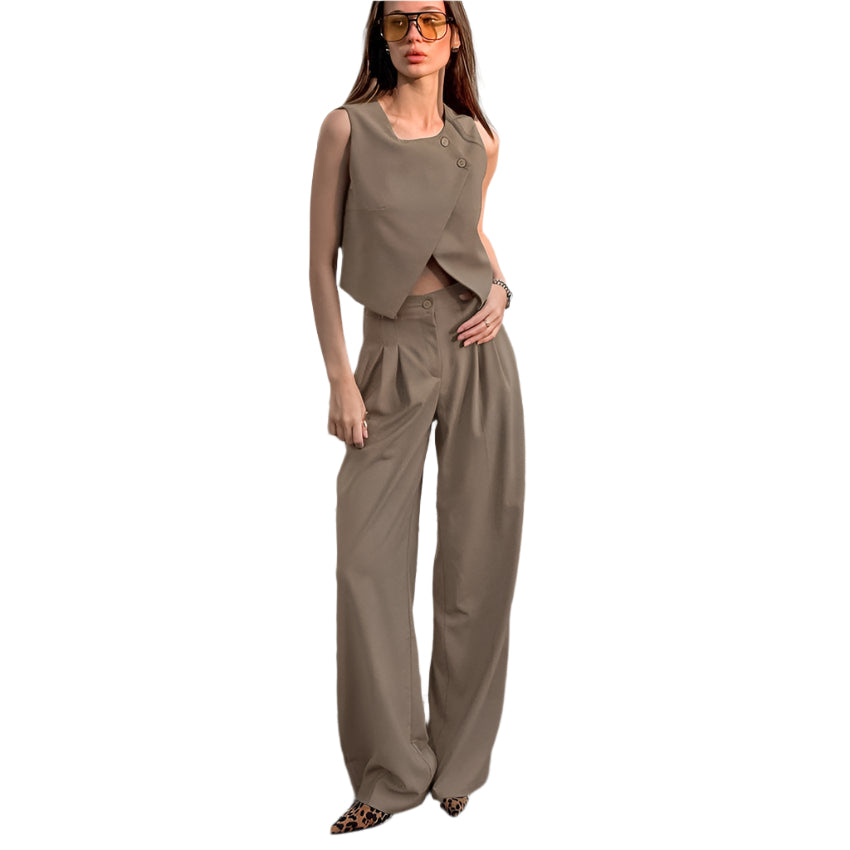 Woman wearing a brown sleeveless tailored vest and wide-leg high waist  pants suit set  on a white background