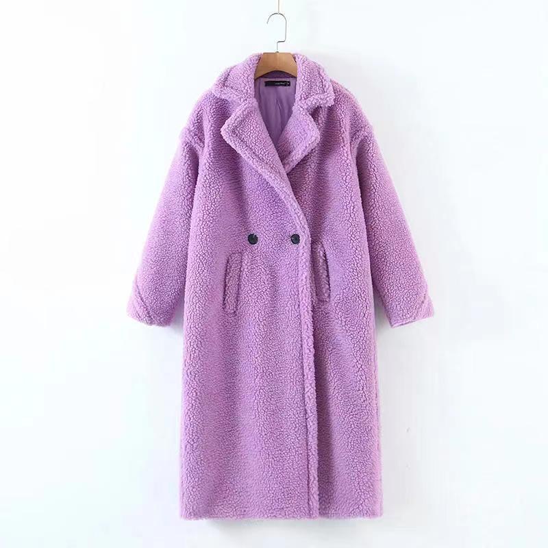 A long purple/lavender plush teddy coat with long sleeves, front buttons and pockets displayed on a hanger against a white background.