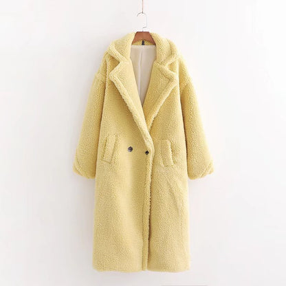 A long yellow teddy plush coat with long sleeves, front buttons and pockets, displayed on a hanger against a white background.