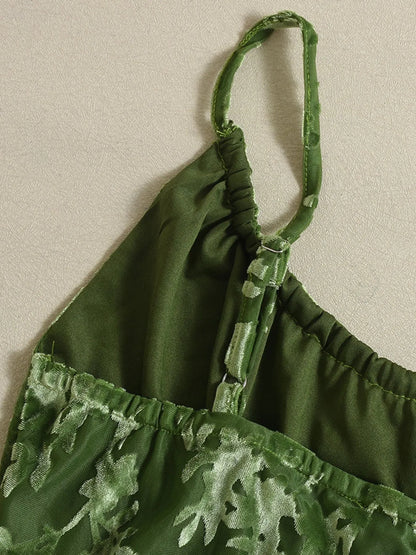 Green textured cami midi dress adjustable straps close up-trimmed top on a beige background