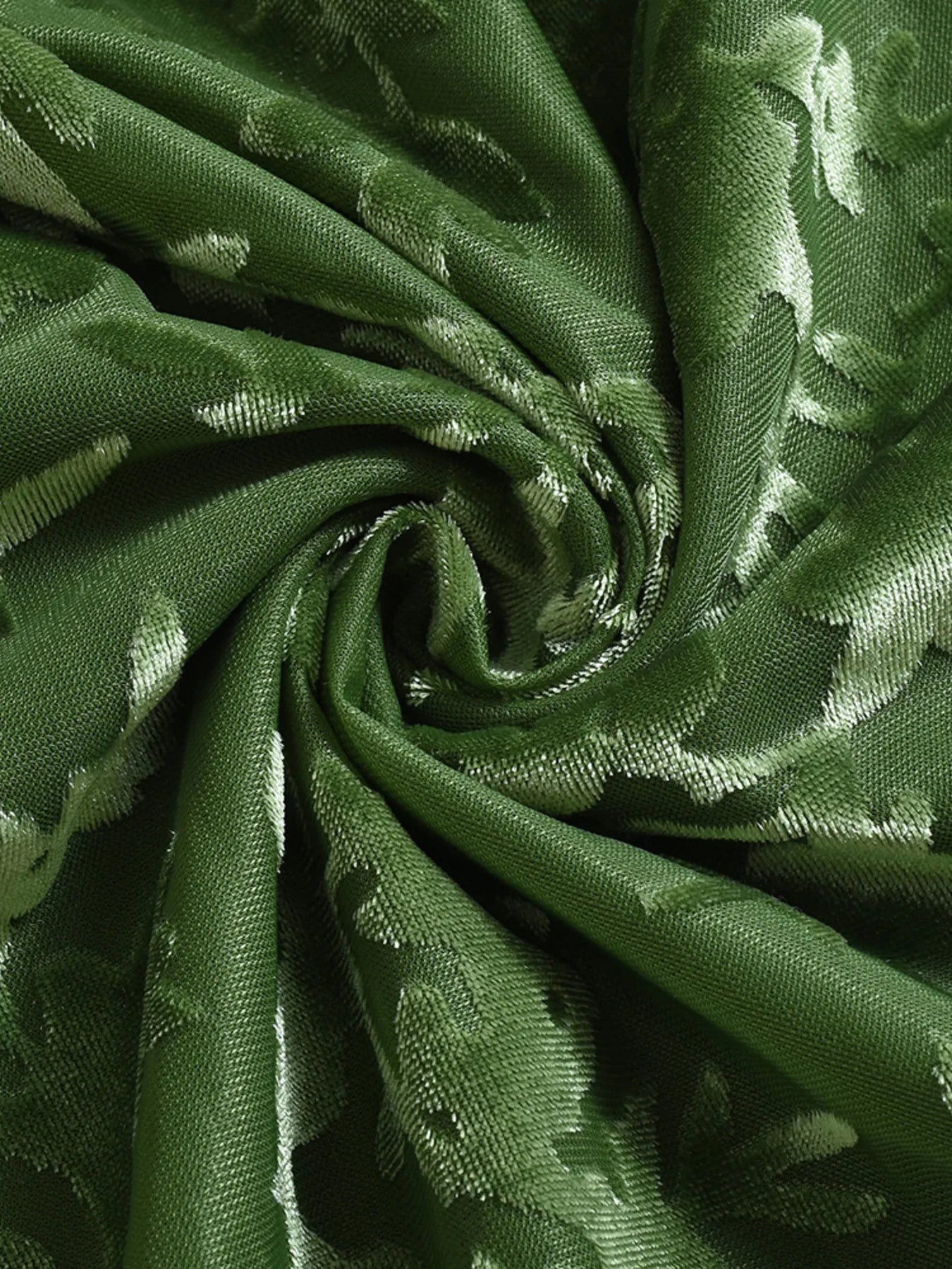 Close-up of green  Textured Tie-Front Bodycon Cami Dress fabric  with floral patterns