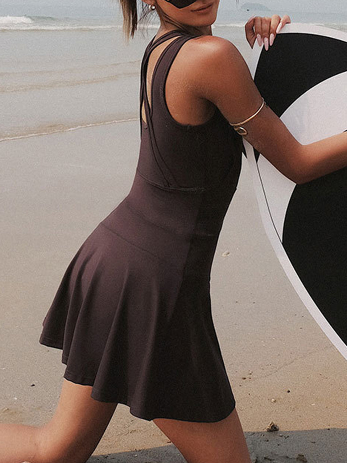 Side view of  brown women's V-neck Workout dress with unitard liner