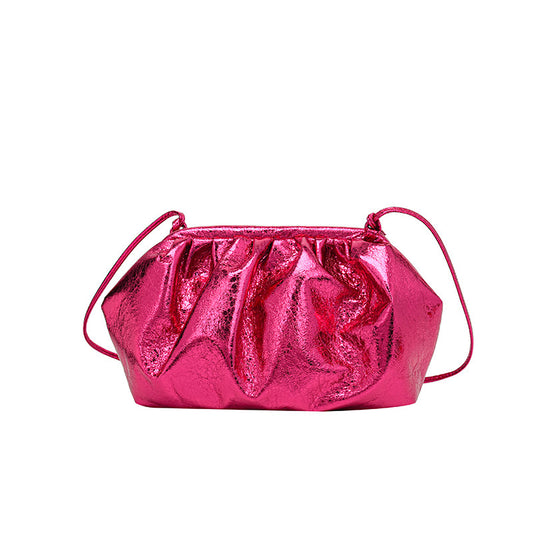 A hot pink colored metallic clip shell bag PU leather clutch with detachable strap