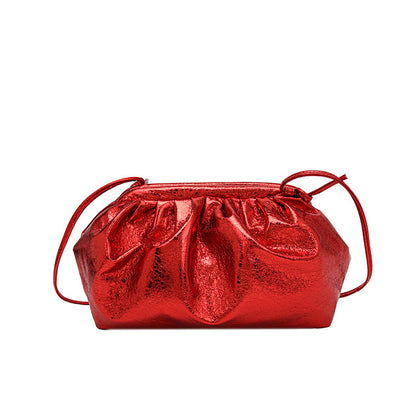 A metallic red colored  PU leather clip shell bag with detachable strap.
