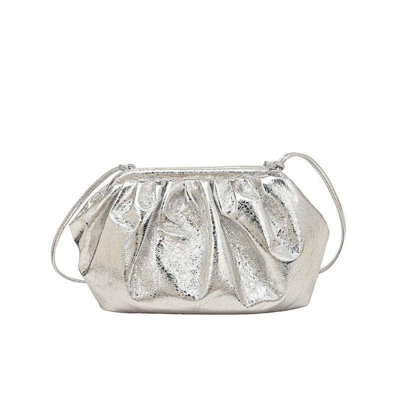 A silver metallic colored clip shell bag  PU leather with detachable strap