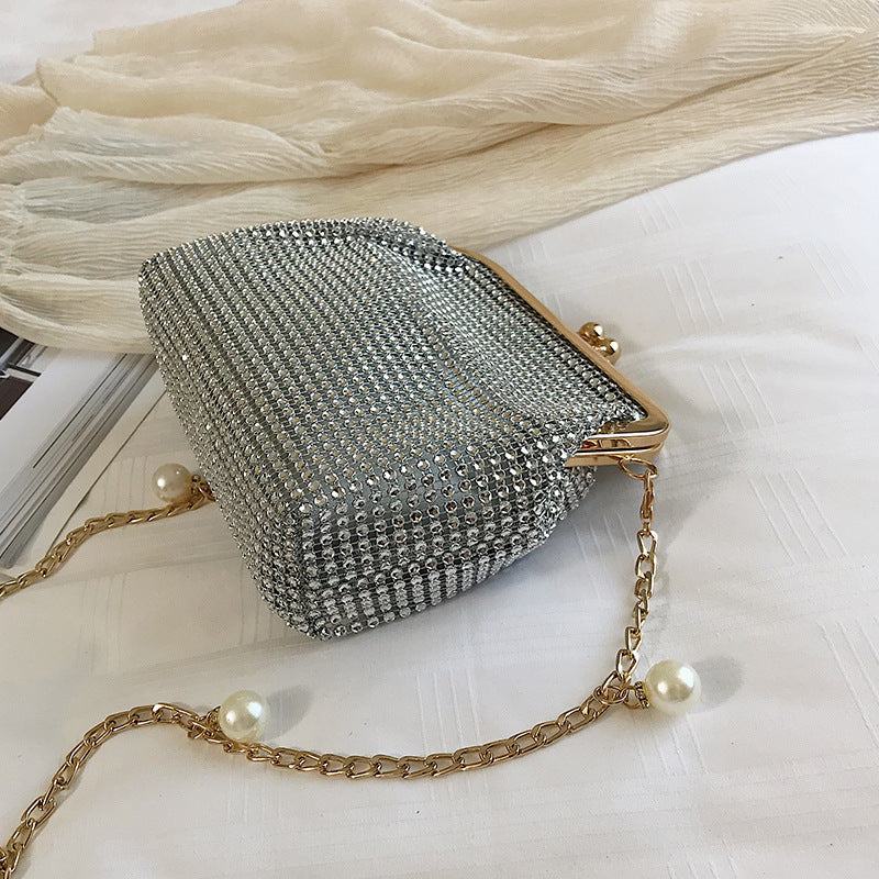 Silver rhinestone evening bag with gold pearl chain strap