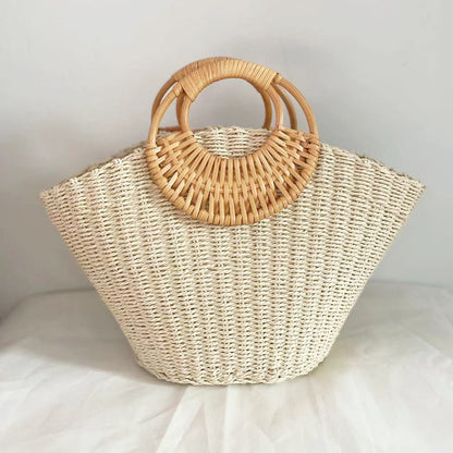 Light Woven handbag with wooden handles on a light background