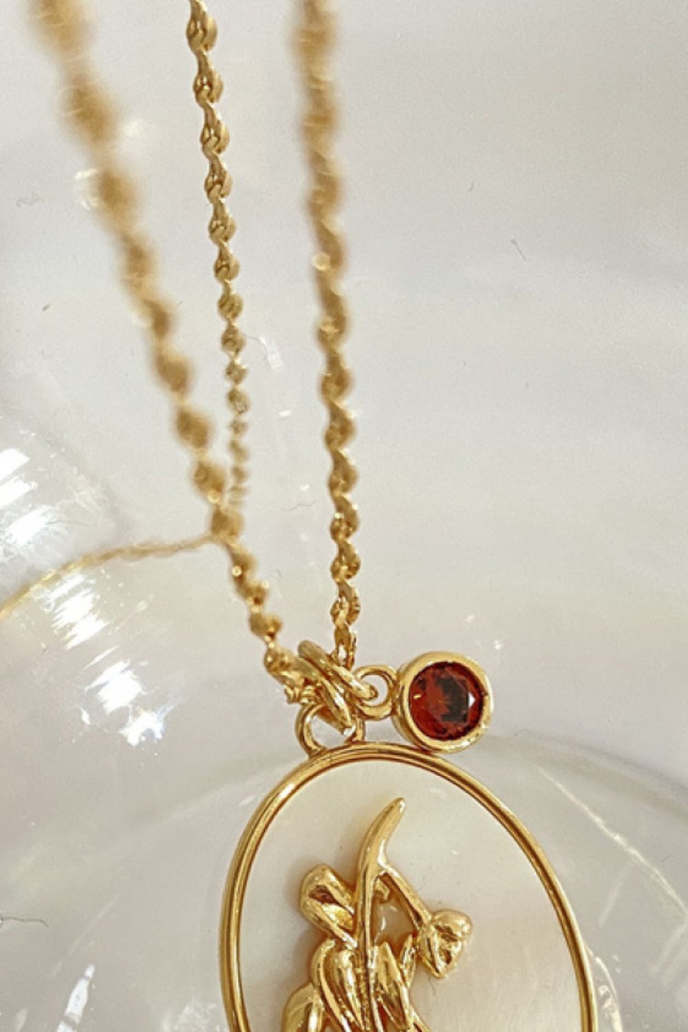 14K gold plated pendant necklaces with feminine floral design close up