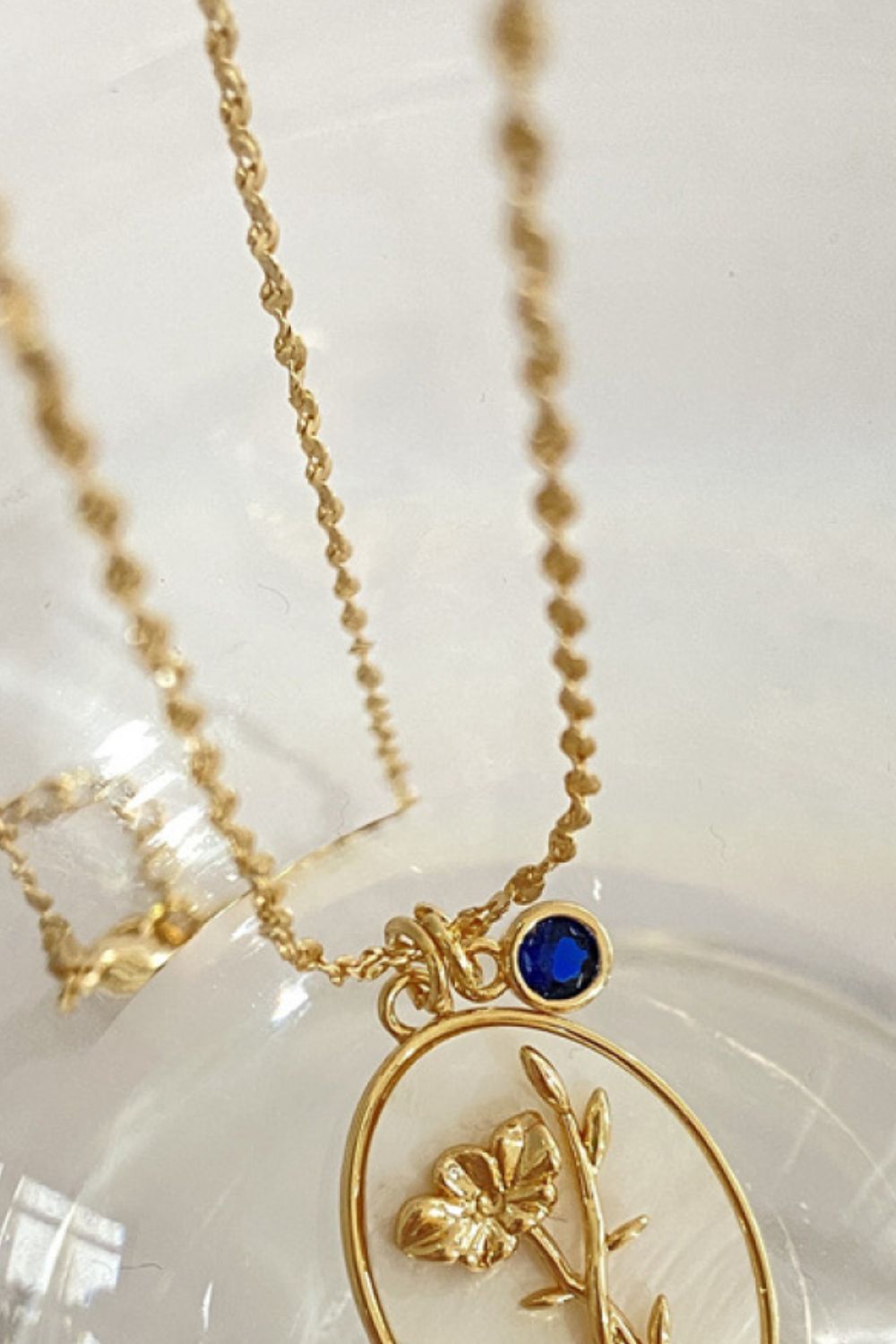 14K gold plated mother of pearl pendant necklaces with feminine floral design close up