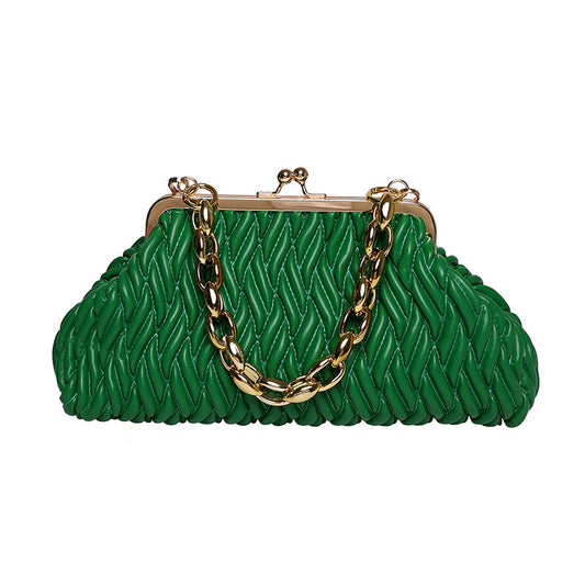 Green clutch leather bag with gold chain handle on a white background