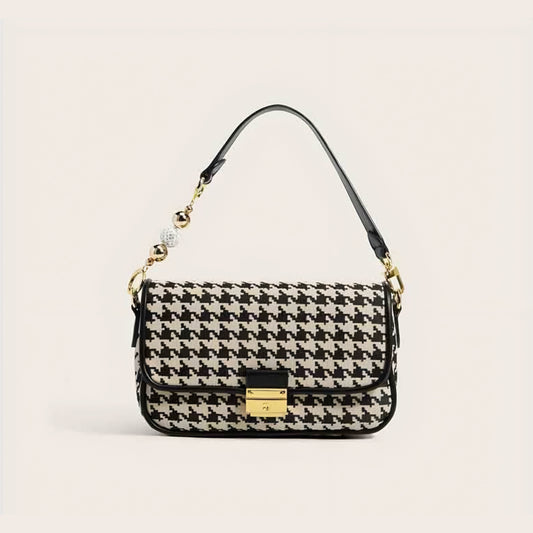 Black and white houndstooth shoulder bag with gold lock and beaded top handle
