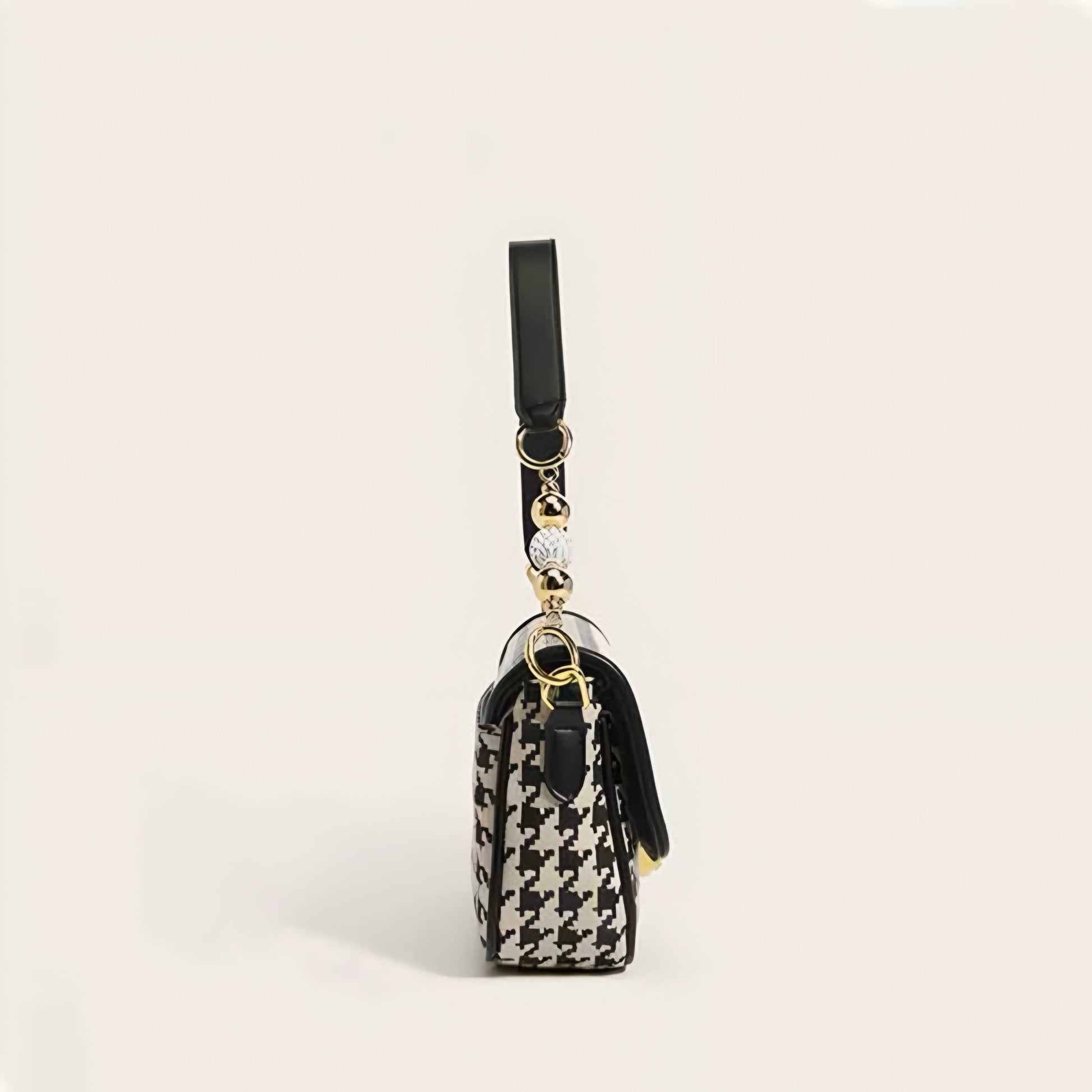 Classic houndstooth pattern purse with gold hardware and pearl-like bead accents