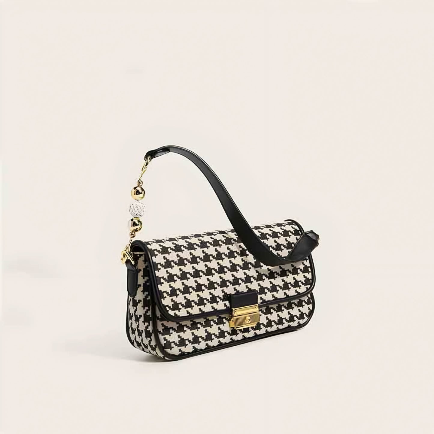 Women's houndstooth handbag with gold-tone lock and fashion-forward design