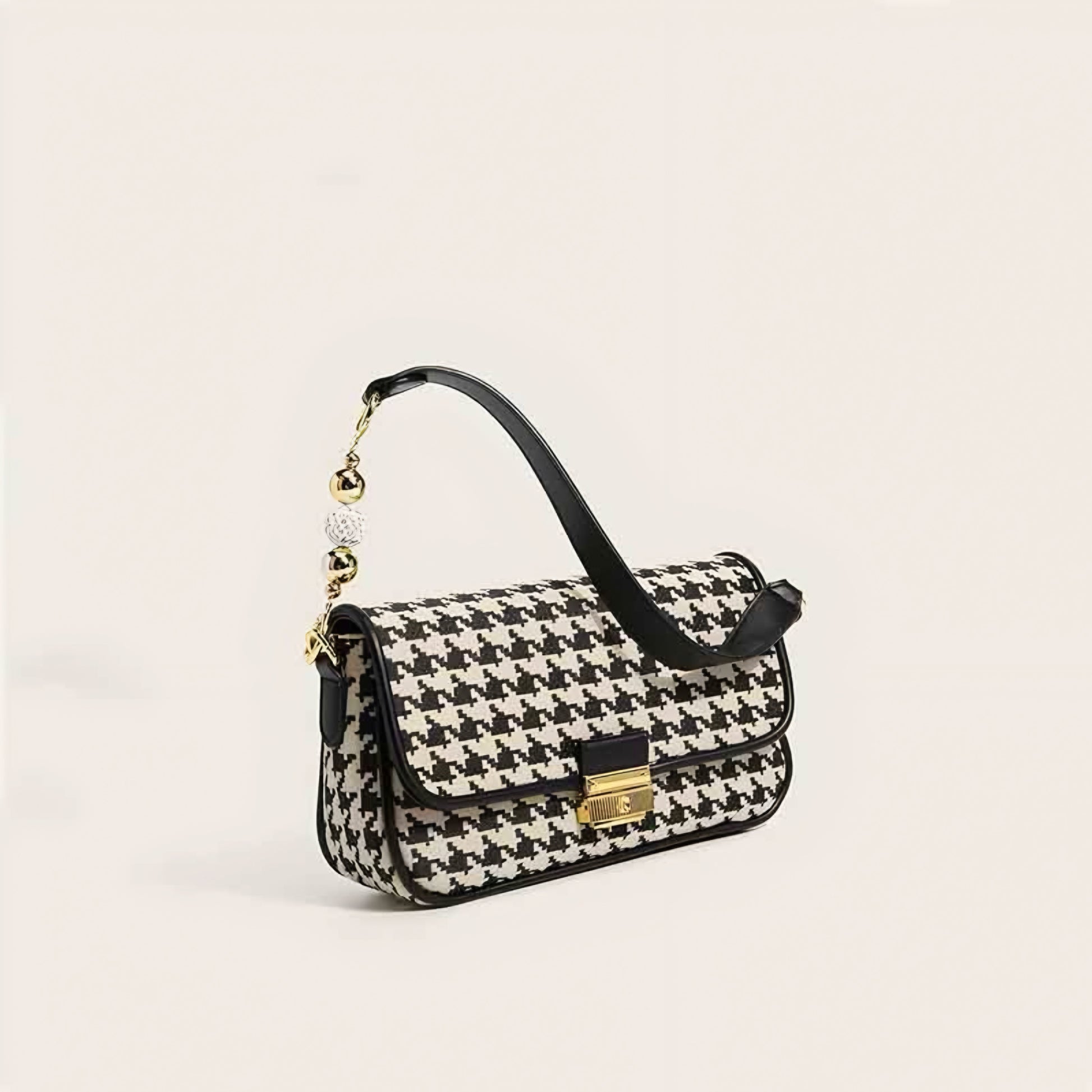 Women's houndstooth handbag with gold-tone lock and fashion-forward design